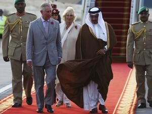 Britain's Prince Charles speaks to Bahrain's Crown Prince Salman bin Hamad bin Isa Al Khalifa upon arriving in Manama, Bahrain, Nov. 8, 2016. Prince Charles and his wife Camilla, seen behind the two princes, are on a three-nation tour of the Gulf. (AFP/File)