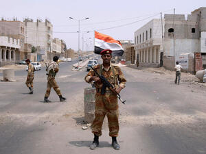 A Yemeni army officer looks on while standing at a checkpoint in Sanaa, Yemen. (AFP/File)
