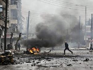 People use buckets to try and extinguish a fire that ignited at a local fuel station in the Bustan al-Qasr neighbourhood of Syria northern city of Aleppo on October 20, 2013. (AFP/File)