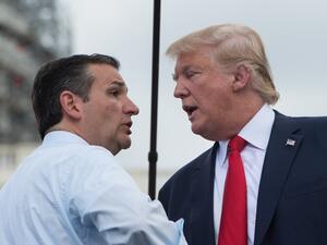 Donald Trump is greeted on stage by Ted Cruz before speaking at a rally against the Iran nuclear deal in Washington on Sept. 9, 2015. (AFP/File)