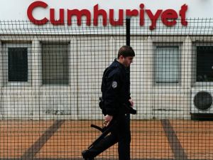 Police man walks by Cumhuriyet daily agency, the media outlet for Erdogan's main political opposition. (AFP/File)