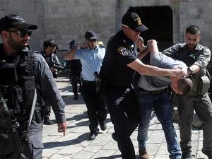 Israeli forces arrest a Palestinian man after Friday prayers at the entrance of Damascus Gate, Jerusalem. (AFP/File)