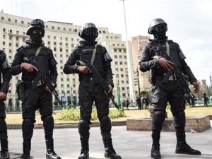 Members of the Egyptian police special forces stand guard on Cairo's landmark Tahrir Square on January 25, 2016. (AFP/File)