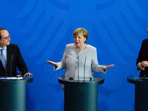 French President François Hollande, German Chancellor Angela Merkel and Italy's Prime Minister Matteo Renzi. (AFP/File)