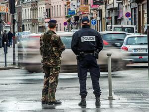 Illustrative photo of a French police officer and a soldier on patrol. (AFP/File)