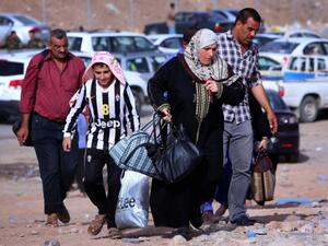 Iraqi refugees arriving in Erbil from Mosul. (AFP/File)
