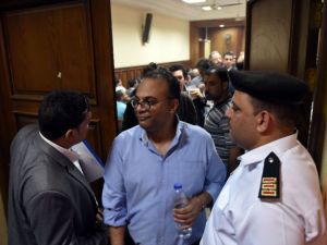 Renowned human rights activist Hossam Bahgat (C), seen here leaving a courtroom. (AFP/File)