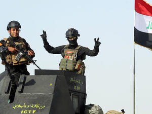 Iraqi forces celebrate as they enter Fallujah. (AFP/Ahmad Al-Rubaye)