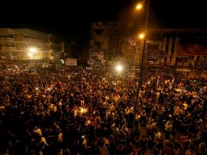 Iraqis gather at the site of the suicide car bomb which killed at least 250 people. (AFP/File)