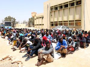 Migrants from sub-Saharan Africa sit at a centre for illegal migrants in Misrata, Libya. (AFP/Mahmud Turkia)