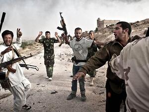 Libyan rebels round-up soldiers loyal to Muammar Gaddafi following their capture after clashes in Libya's western mountain region of Qalaa. (AFP/File)