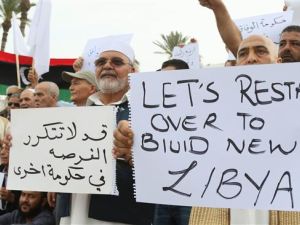 Pro-UN-backed government protesters hold placards and shout slogans during a demonstration in Libya. (AFP/File)