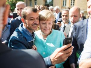 Asylum seeker takes a selfie picture with German Chancellor Angela Merkel. (AFP/File)