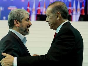 Turkey's Prime Minister Recep Tayyip Erdogan, right, and Palestinian Hamas leader Khaled Meshaal. (AFP/File) Turkey's Prime Minister Recep Tayyip Erdogan, right, and Palestinian Hamas leader Khaled Meshaal. (AFP/File)