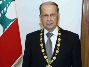 Lebanese President Michel Aoun posing with the presidential medal at the presidential palace of Baabda. (AFP/File)