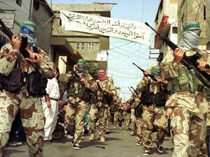 Gunmen march through Sidon's Ain al-Helweh camp. (AFP/Mahmoud Zayat)