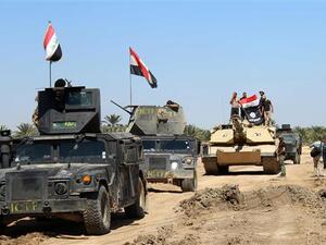 Iraqi Counter Terrorism Forces drive their armored vehicles after they retook an area from Daesh on April 2, 2016 in the village of Al-Mamoura, near Hit, Anbar Province. (AFP/File)