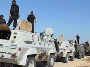 Egyptian security forces stand by their armored personnel carriers in North Sinai. (AFP/File)