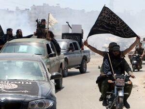 Fighters from Al-Qaeda's Syrian affiliate Al-Nusra Front patrol the northern city of Aleppo in May 2015. (AFP/Fadi al-Halabi)