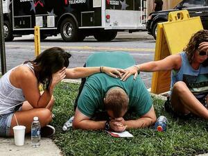 People mourn their lost loved ones outside the Pulse nightclub where the attack took place. (AFP/File)