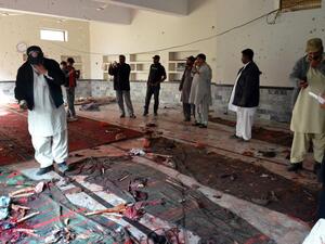 Pakistani security officials gather at a Shiite Muslim mosque after a bomb explosion in Shikarpur. (AFP/File)