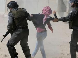Israeli forces detain a Palestinian protester during a rally by college students near Ramallah against the incarceration of Palestinian students in the West Bank village of Betunia, outside the Israeli-run Ofer prison, March 10, 2015. (AFP/File)
