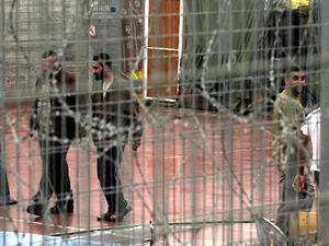 Palestinian prisoners walk 06 November 2005 at the yard of Megiddo prison. (AFP/File)