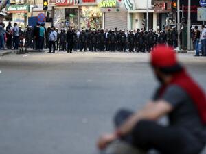 A protester sits in front of riot policemen during a demonstration on April 15, 2016 in central Cairo against a controversial deal to hand two islands in the Red Sea to Saudi Arabia. (AFP/Mohamed El-Shahed) A protester sits in front of riot policemen during a demonstration on April 15, 2016 in central Cairo against a controversial deal to hand two islands in the Red Sea to Saudi Arabia. (AFP/Mohamed El-Shahed)