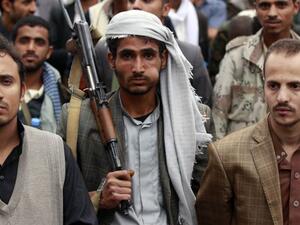 A supporter of the Shia Houthi movement chews Qat, a mild drug used daily by most Yemenis, as he carries a rifle during a demonstration against the Saudi-led air strikes, in the capital Sanaa, on May 8, 2015. (AFP/Mohammed Huwais) A supporter of the Shia Houthi movement chews Qat, a mild drug used daily by most Yemenis, as he carries a rifle during a demonstration against the Saudi-led air strikes, in the capital Sanaa, on May 8, 2015. (AFP/Mohammed Huwais)