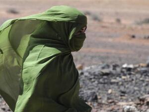 A Sahrawi woman walks in the desert near the Western Sahara village of Tifariti. (AFP/File)