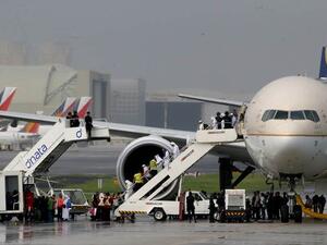 Television footage had shown the plane, reportedly carrying around 300 people, surrounded by dozens of security vehicles and officers armed with high-powered firearms at an isolated area of the runway at Manila's airport. (AFP/File)