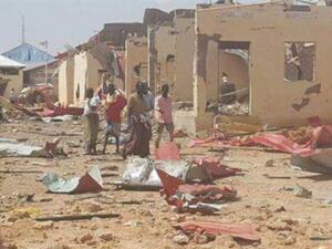 People gather at the site of car bomb attacks in the town of Galkayo, in the semi-autonomous Puntland region of Somalia, August 21, 2016. (File photo)