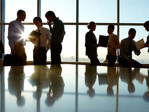 People form their impressions of a new co-worker based on many factors, including simply how this person is able to handle himself or herself in the first few days. (File photo)