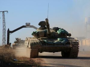 Syrian government forces in the village of Tal Jabin, north of the embattled city of Aleppo, as they advanced to break a three-year rebel siege of two government-held Shia villages, Nubol and Zahraa, on February 3, 2016. (AFP/George Ourfalian)