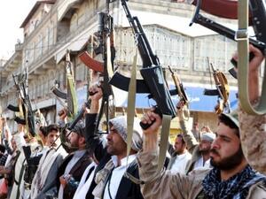 Tribal gunmen loyal to the Houthi movement brandish their weapons in the capital Sanaa. (AFP/File) 