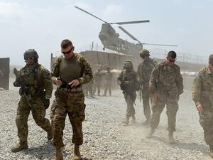 U.S. Army soldiers walk as a NATO helicopter flies overhead at coalition force Forward Operating Base (FOB) Connelly in the Khogyani district in the eastern province of Nangarhar on August 13, 2015. (AFP/Wakil Kohsar) U.S. Army soldiers walk as a NATO helicopter flies overhead at coalition force Forward Operating Base (FOB) Connelly in the Khogyani district in the eastern province of Nangarhar on August 13, 2015. (AFP/Wakil Kohsar)