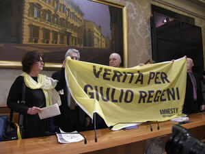 The parents of killed Italian student Giulio Regeni unveil a banner reading 'Truth for Giulio Regeni'. (AFP/File)