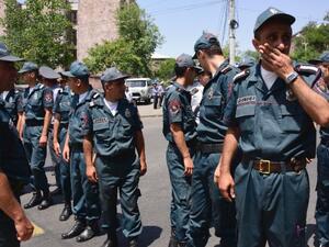 Armenian police officers block the streets to Erebuni police station in Yerevan on July 17. (AFP/File)