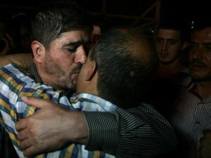 One of the Palestinian leaders of the Islamic Jihad movement in the West Bank, Jaafar Ezzeddine embraces a relative after being release from an Israeli prison in the West Bank city of Jalama, near Jenin, on May 8, 2013. (SAIF DAHLAH/AFP/Getty Images)