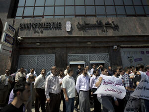 The banking crisis started last Wednesday with Hamas-affiliated police officers preventing PA employees from collecting their wages (AFP/ File).