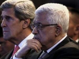 الرئيس الفلسطيني محمود عباس ووزير الخارجية الأمريكي جون كيري