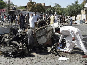 Pakistani security officials inspect the site of a powerful explosion that targeted a police vehicle in Quetta on June 23, 2017. (AFP)