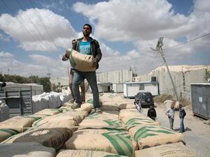 Israel restricts the entry of goods into Gaza out of fears they will be used to build tunnels, but Gazans desperately need cement for reconstruction. (AFP/Said Khatib)