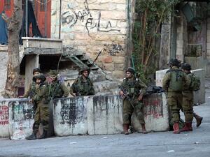 IDF soldiers on patrol in Hebron. (AFP/File)