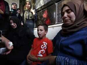 Relatives of Iyad Hamed, 38, mourn during his funeral in the West Bank village of Silwad after he was killed by Israeli troops on August 26, 2016. (AFP/Abbas Momani)