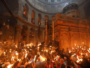 Christian orthodox worshippers hold candles during the "Holy Fire" Easter celebration in Jerusalem's Church of the Holy Sepulchre, Saturday 15 April 2017. (AFP/Gali Tibbon)