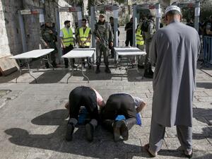 Security measures added by Israel to Al-Aqsa last week sparked Palestinian rage (AFP)