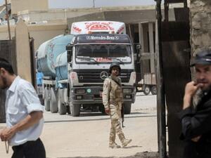 Egyptian trucks carrying fuel enter the southern Gaza Strip from Egypt through the Rafah border crossing on June 21, 2017. (AFP/ Said Khatib) 