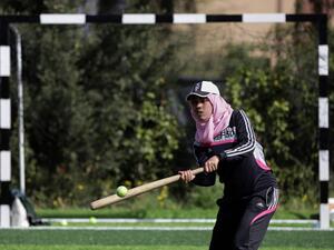 The women who make up Gaza's first baseball team don caps over their hijabs and often play using improvised equipment, like tennis balls. (AP Photo)