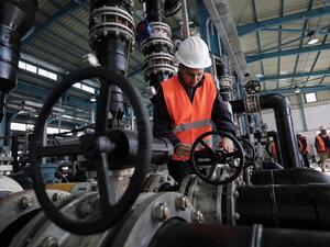 A Palestinian employee works at a desalination plant during the inauguration of the first phase of the project on January 19, 2017, in Deir al-Balah in central Gaza. (AFP/Said Khatib)